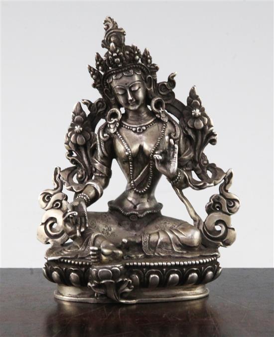 An unusual Tibetan silver seated figure of Green Tara, possibly 19th century, 11.7cm